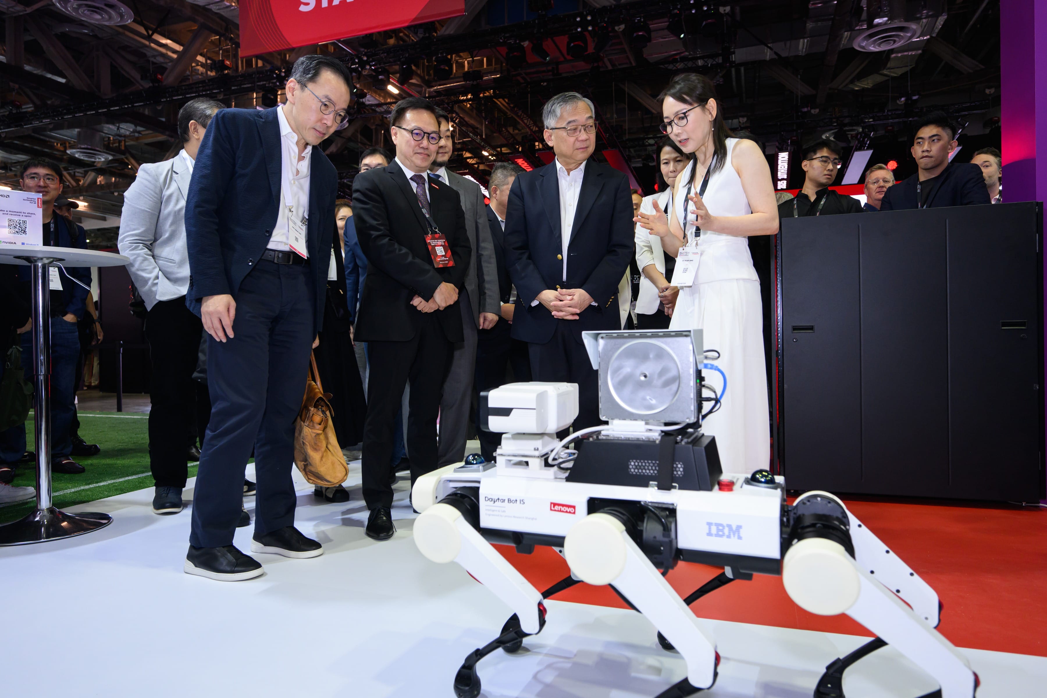 An exhibitor Showcases their robotics innovations to DPM Gan Kim Yong